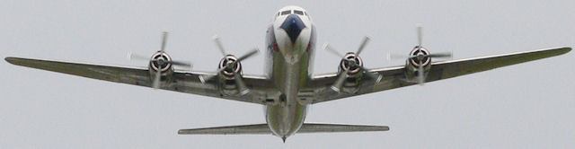 DC-7 Flying past